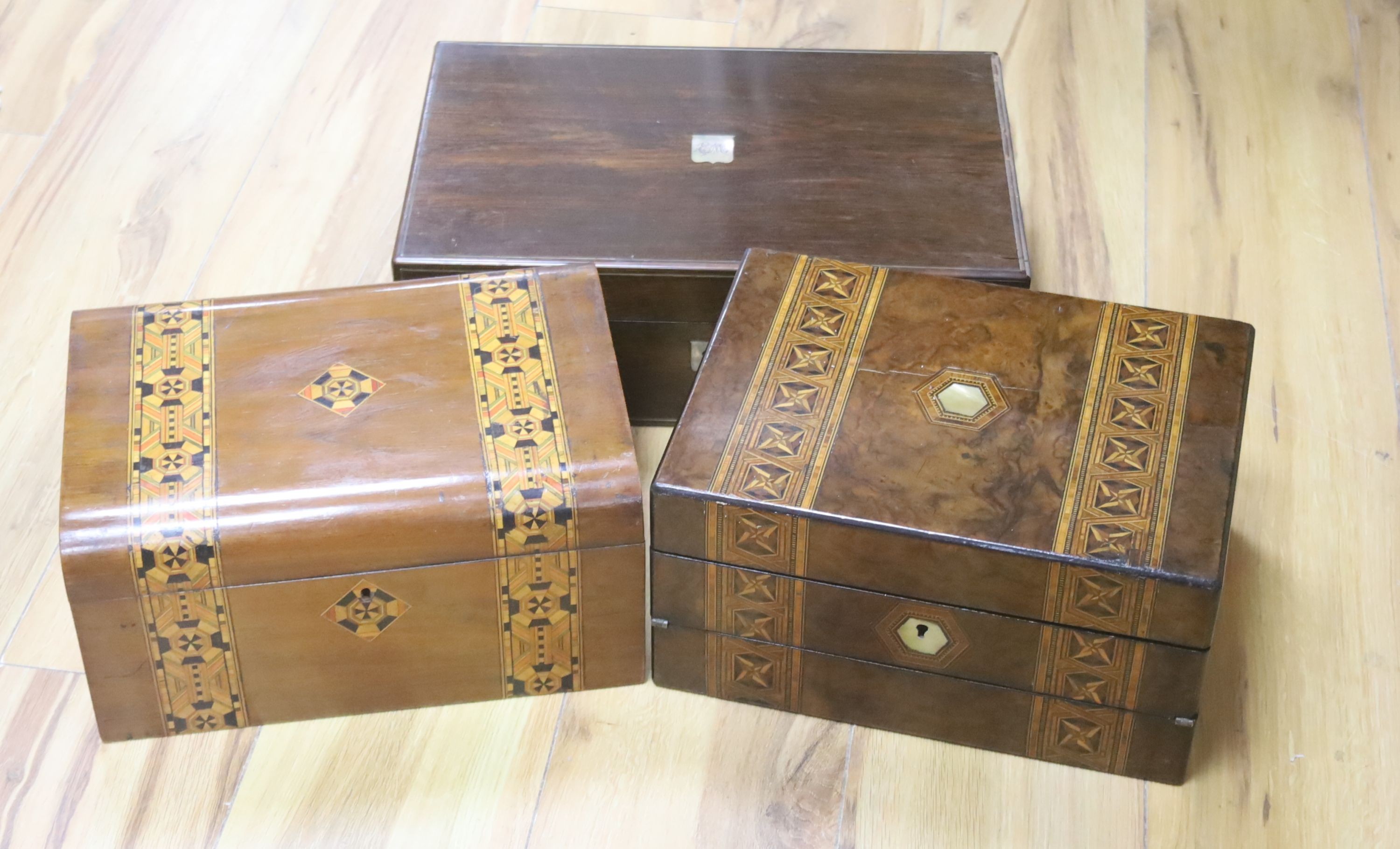 A Victorian rosewood writing box and two Victorian walnut and parquetry boxes